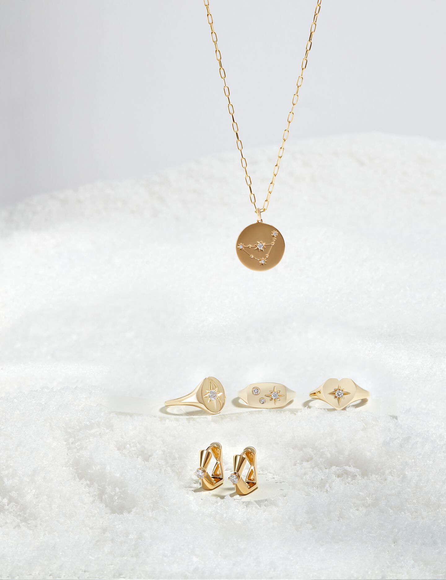 Ikuma Canadian Diamond necklace, signet rings, and earrings in snow
